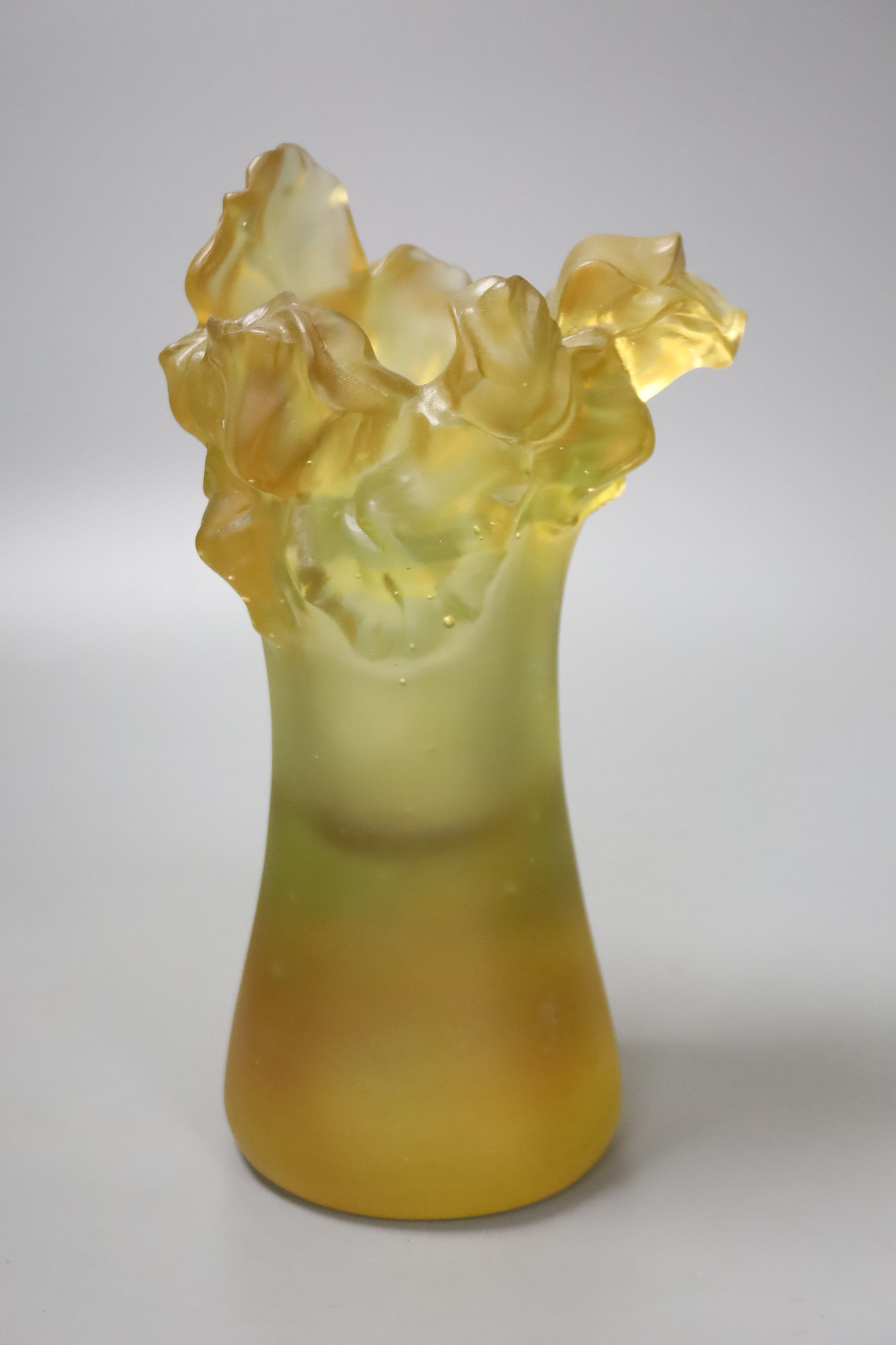 An amber vase with a nude study in relief, apocryphal Daum mark, 24cm high